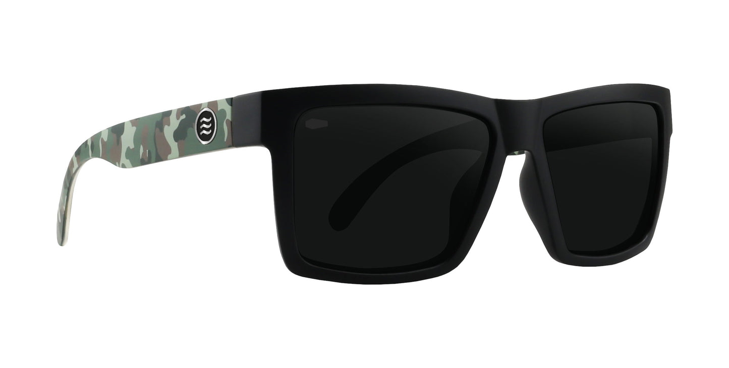 Neven Eyewear’s Bad Company sunglasses feature rectangular polarized UV400 lenses with a sleek reflective finish. The arms display a gray, green, and white camo pattern and a white Bad Company logo on the left side.