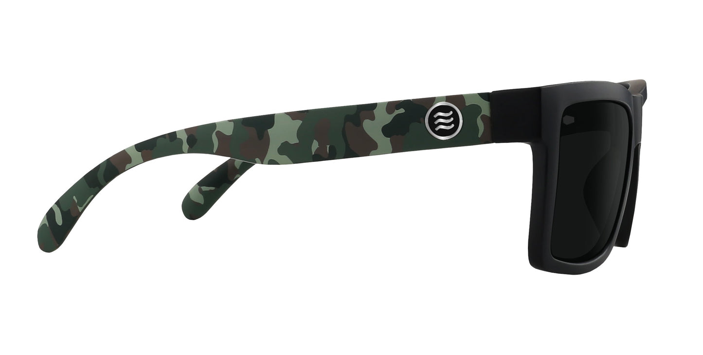 The Bad Company sunglasses by Neven Eyewear feature black rectangular frames, dark polarized UV400 lenses, and arms with a green, brown, and black camo pattern plus a white circular logo with three wavy lines.