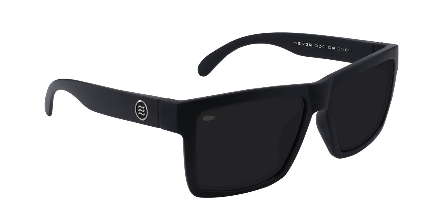 The Neven Eyewear Lowrider sunglasses feature matte black rectangular frames with a circular white logo on the left temple and "NEVER ODD OR EVEN" in bold white uppercase letters inside the right arm.