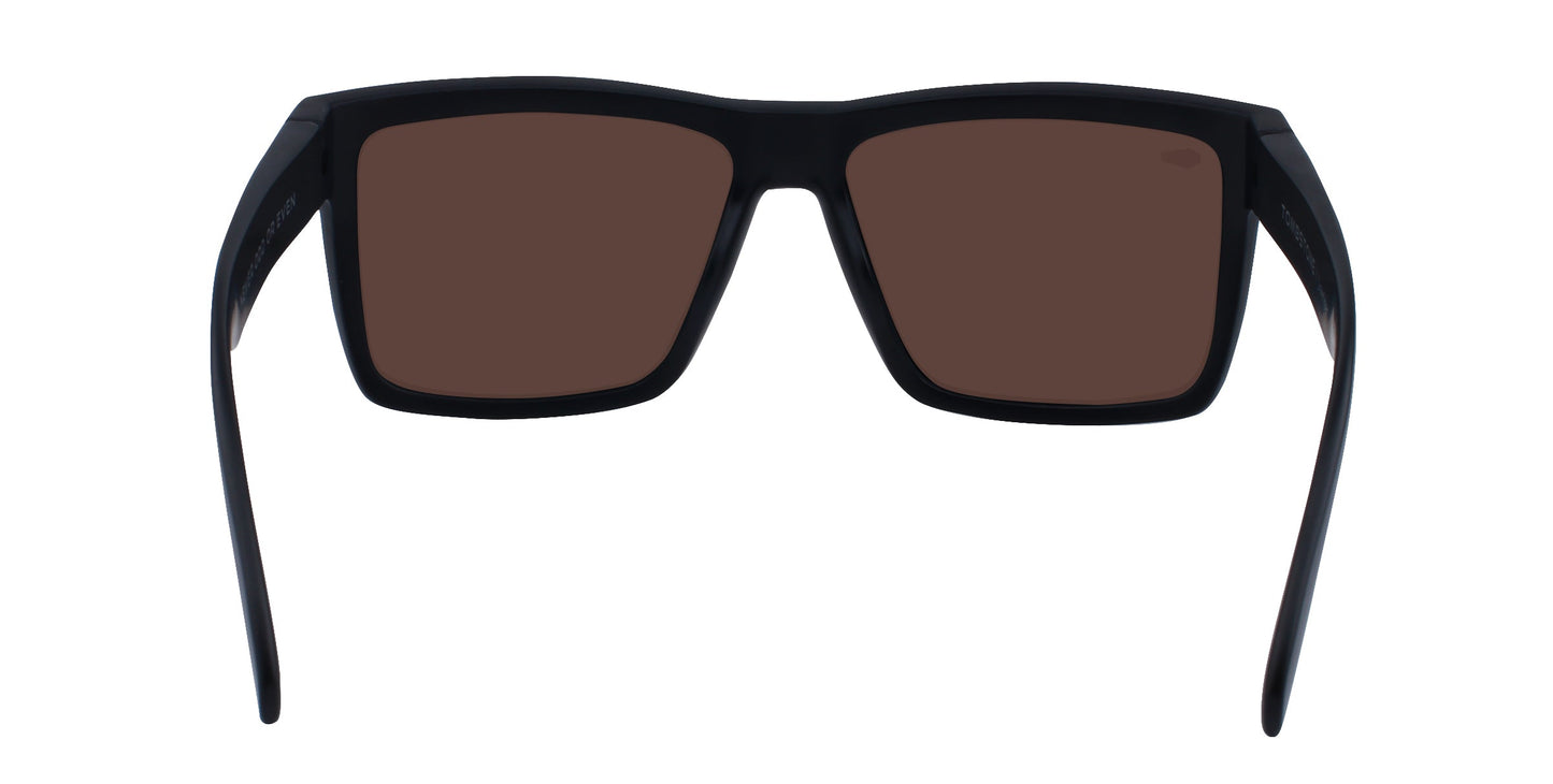 The Montauk sunglasses by Neven Eyewear feature thick black frames, wide arms, and large dark brown lenses for full coverage. Stylishly suited for the beach, they’re shown head-on against a white background.