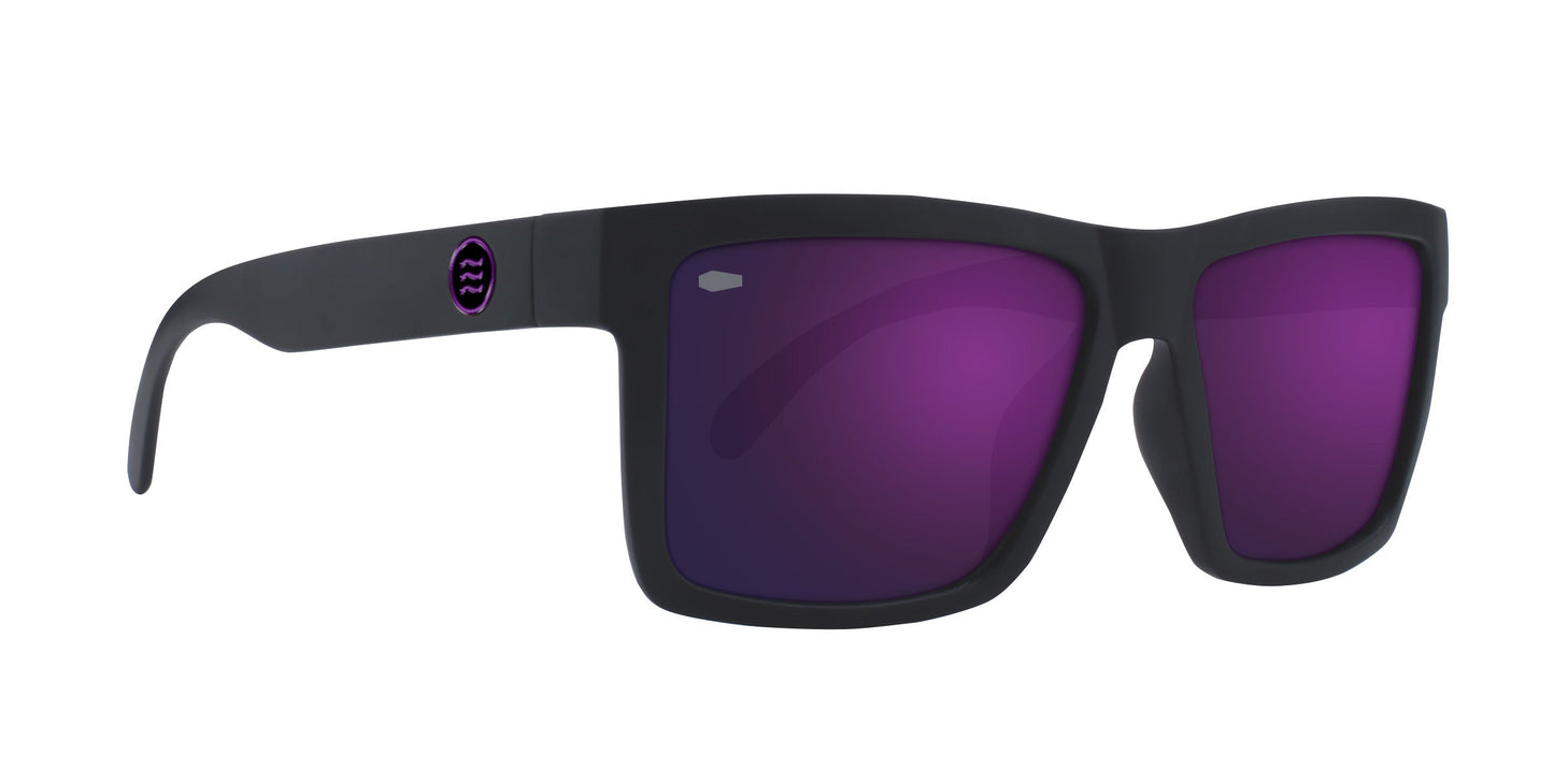The Neven Eyewear Nightshade sunglasses feature a matte black rectangular frame with wide arms, dark purple-tinted lenses, and a small circular purple-black logo near the left hinge for a modern gothic look.