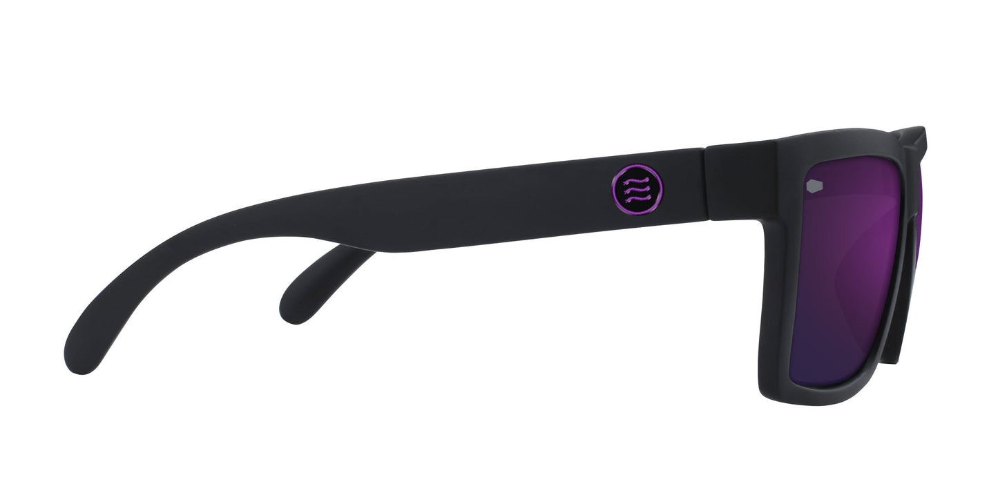 Neven Eyewear’s Nightshade sunglasses feature thick matte black frames, purple-tinted polarized lenses, and a modern sporty design. A side view shows the temple arm’s small circular logo with purple detailing.