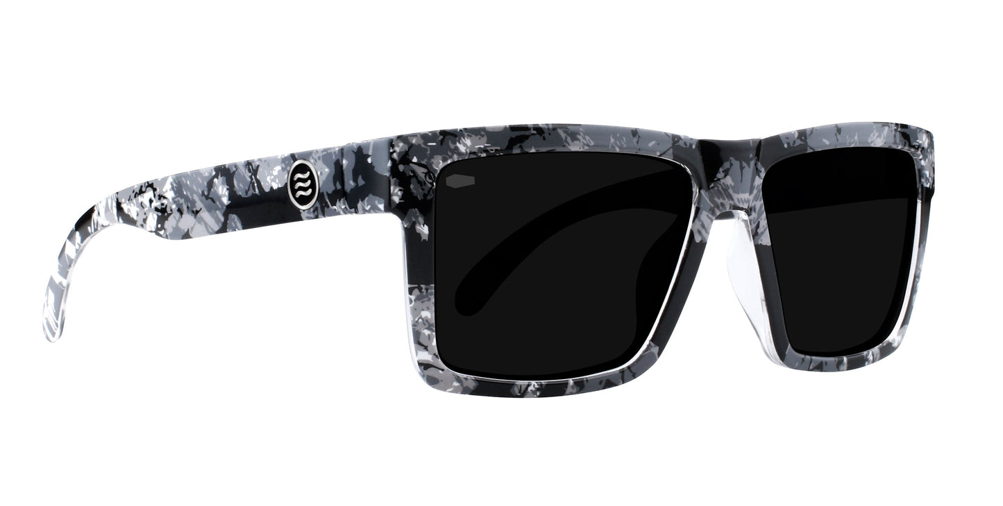 South Shore by Neven Eyewear: Rectangular sunglasses with thick black lenses, a marbled black/white/gray frame, small circular logo on the left temple, and a bold style inspired by Tim Howley’s high-contrast aesthetic.