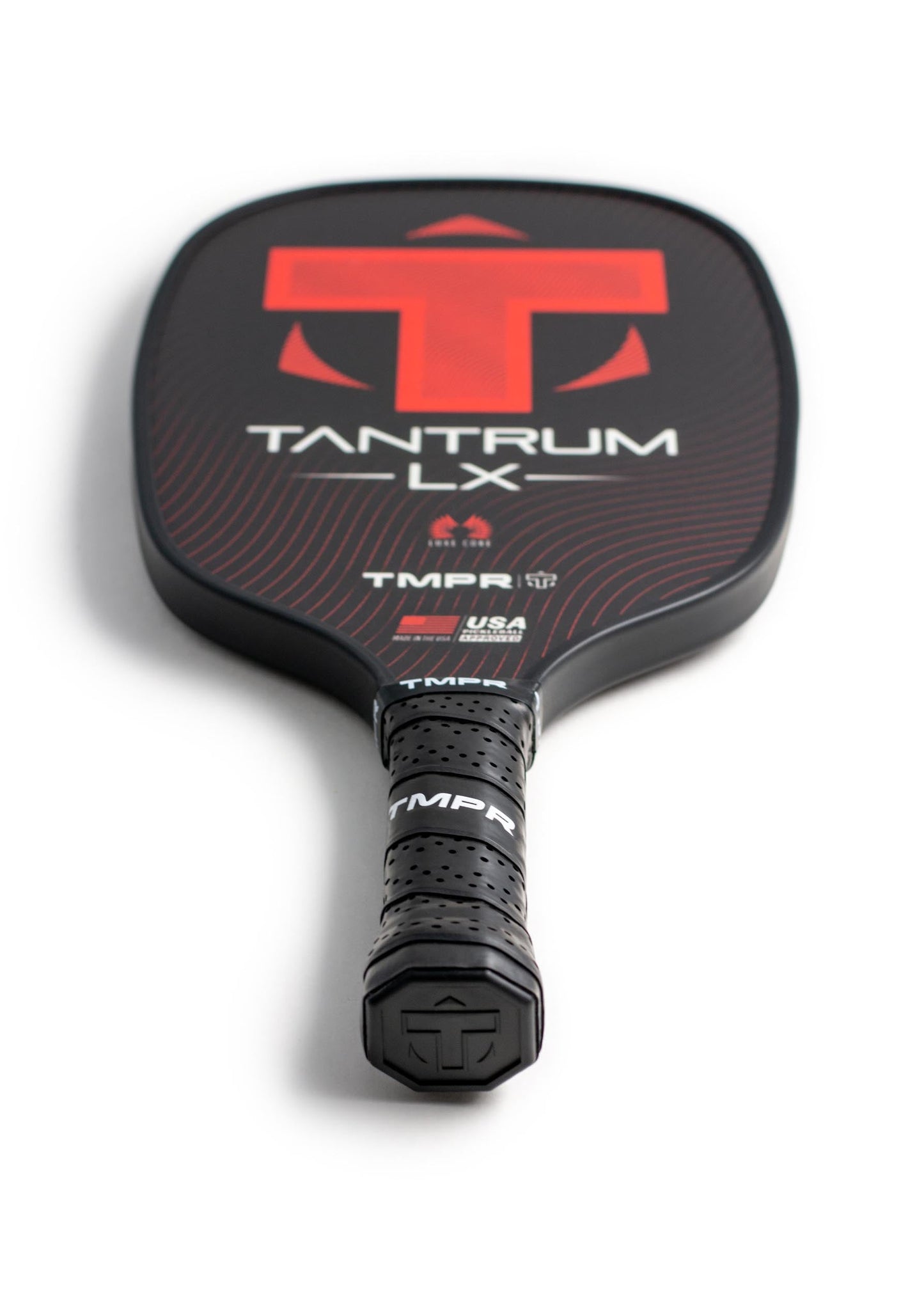 The TMPR Sports Tantrum LX pickleball paddle features a black, elongated face with red and white accents, a prominent red T logo at the top, bold TANTRUM LX lettering, perforated black grip tape, and an end cap T logo.