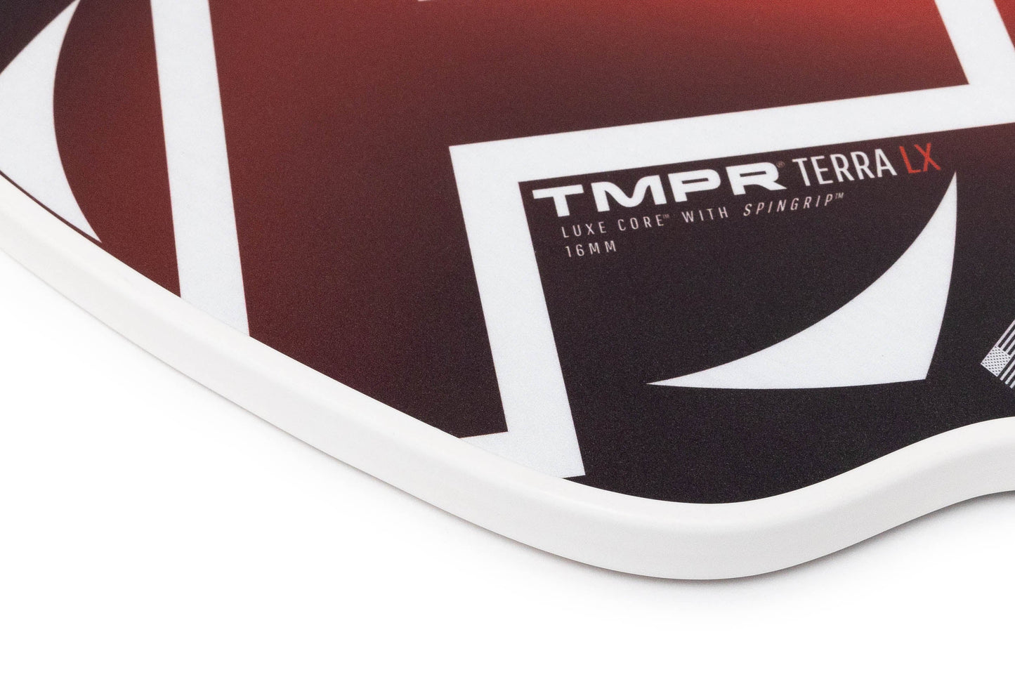 Close-up of the TMPR Sports Terra LX pickleball paddle with a red and black geometric design, white border, and SpinGrip™ 16MM. It features sharp white accents, a smooth finish, and advanced vibration dampening technology for comfort.