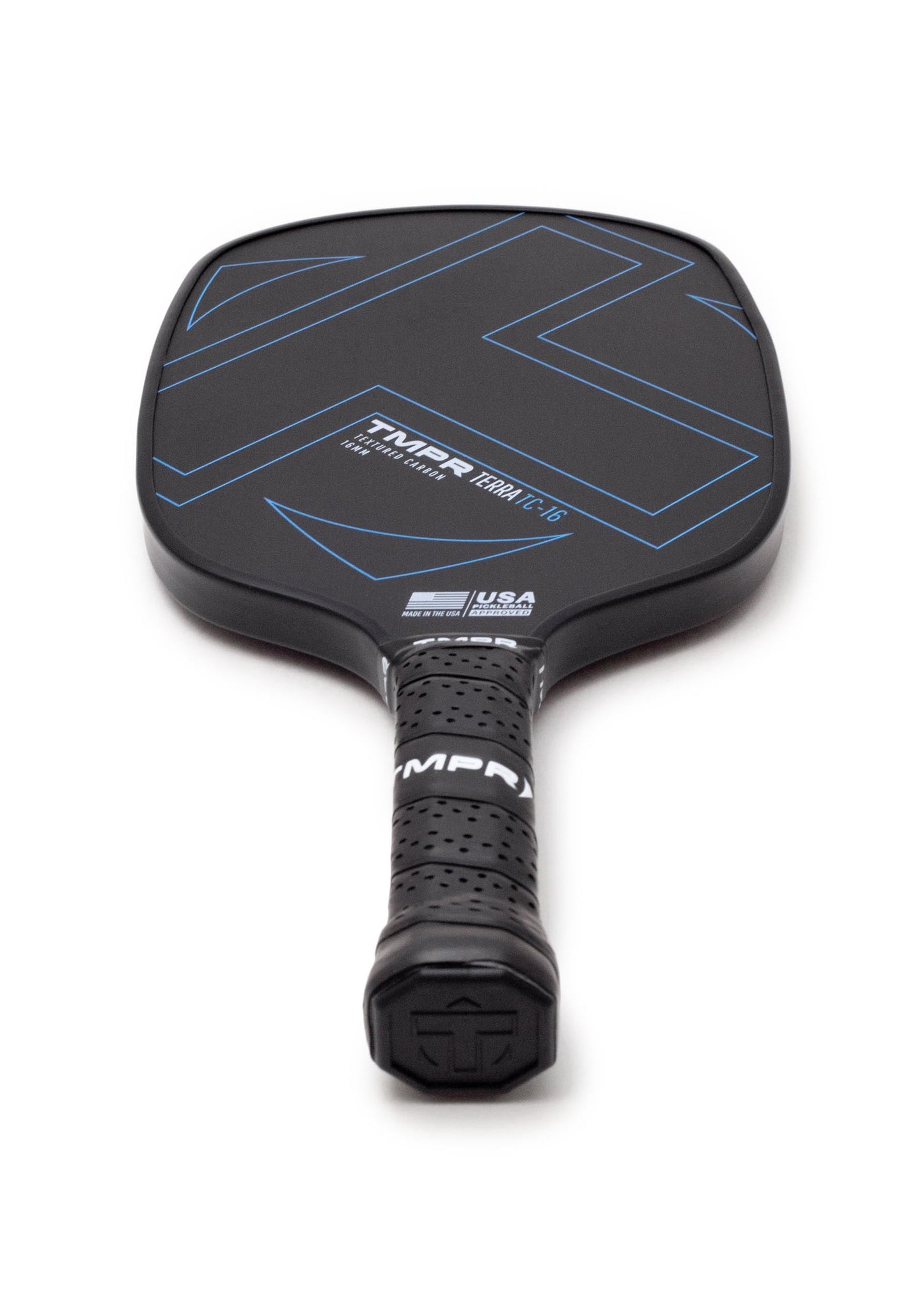 A black TMPR Sports Terra TC-16 pickleball paddle with blue geometric lines, a T700 textured carbon surface, and TMPR branding above the handle, plus a perforated black grip over a honeycomb poly core, viewed from the handle end.