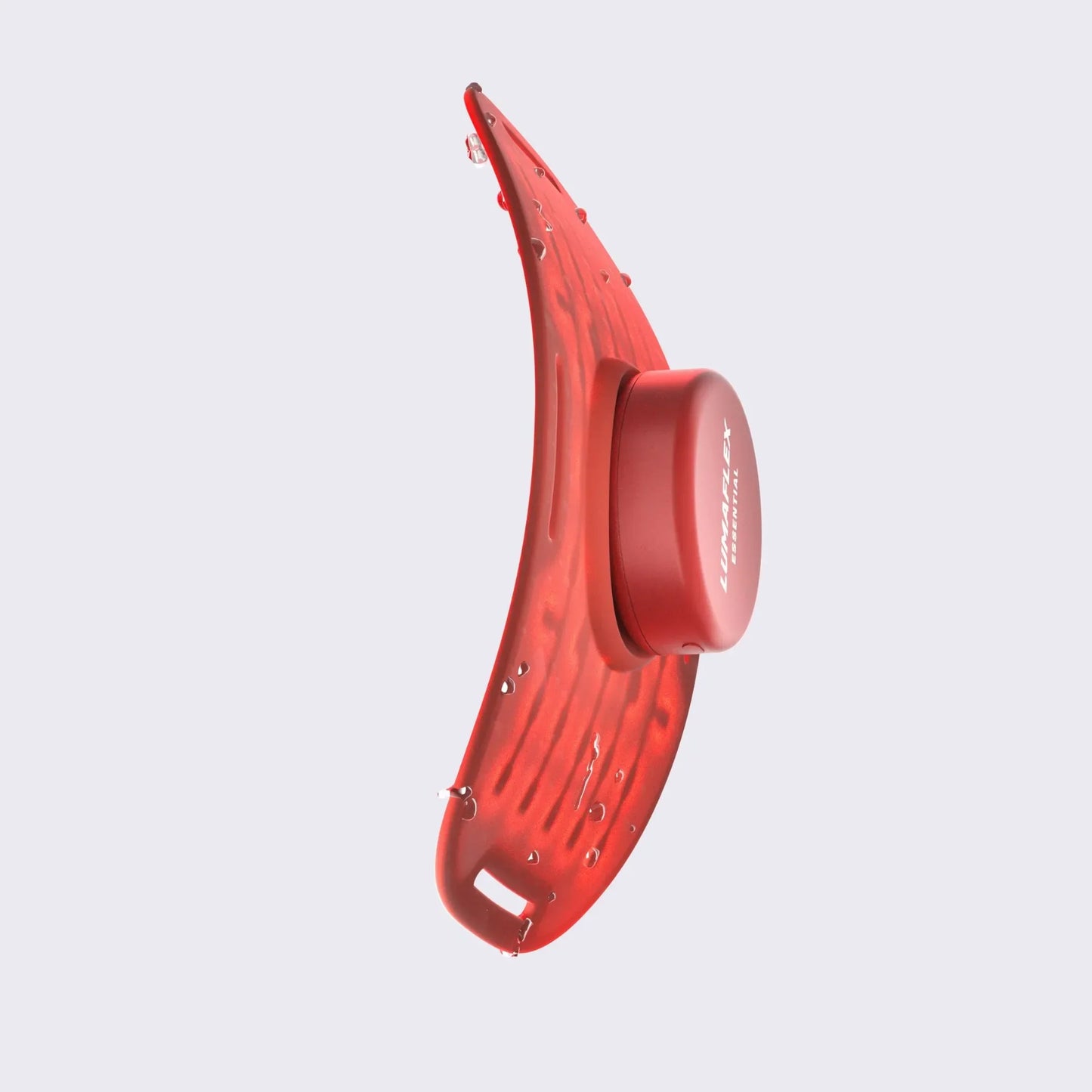 The iReliev Essential Red Light and Infrared Therapy Wrap features a modern, curved red design with a central circular element and small surface protrusions, shown against a light gray background—suggesting advanced wearable therapy.