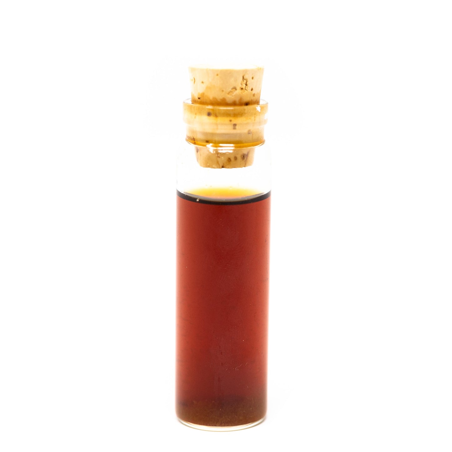 A small glass vial of Roots Apothecary energy tincture, inspired by organic green tea with L-Theanine & Caffeine for memory and focus support, is sealed with a light cork stopper and stands upright against a plain white background.