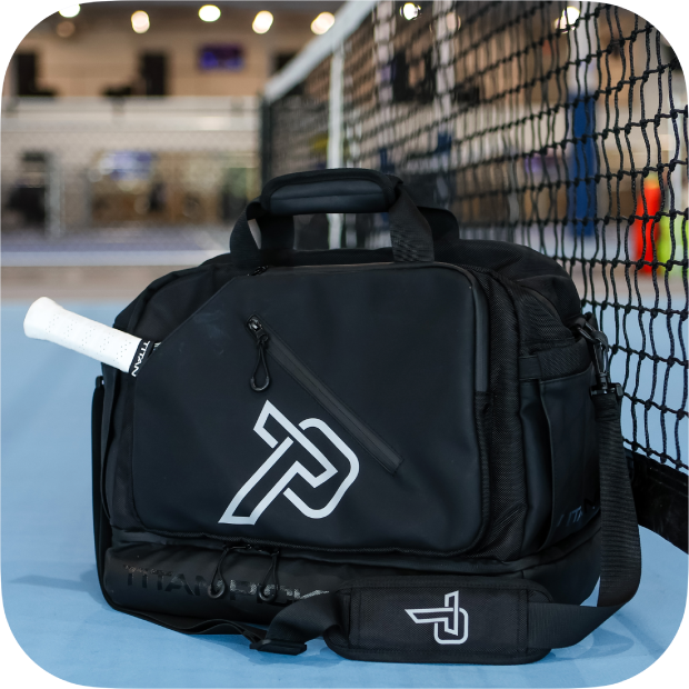 The Titan Duffle Bag by Titan Pickleball is a premium black pickleball bag with a dedicated tennis racket pocket, keeping you organized and tournament-ready.
