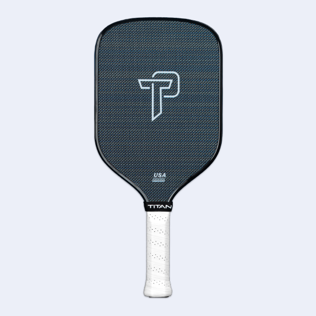 The Titan Pro Titanium 14L by Titan Pickleball features a textured blue carbon fiber face, bold white TP logo, and "USA" and "TITAN" near the perforated grip—ideal for those seeking high-quality pickleball paddles.
