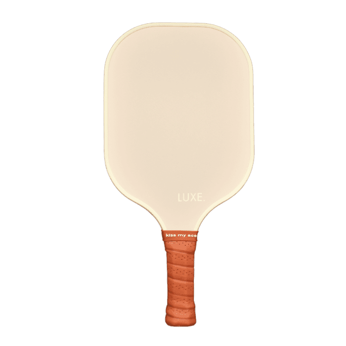 A beige carbon fiber paddle from the Core Collection by LUXE Pickleball, featuring rounded corners, a smooth surface with "LUXE." near the bottom, a textured brown grip handle with “kiss my ace.” above, and USA Pickleball Approved.