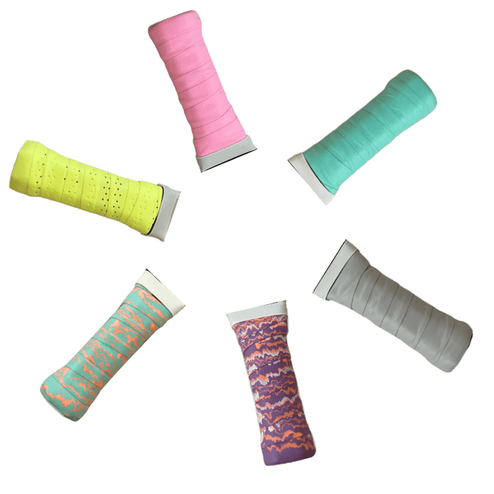 Six LUXE Pickleball Paddle Grips in yellow, teal, gray, pink, purple with zigzags, and teal with a pink-orange zigzag pattern are arranged in a circle on a white background.