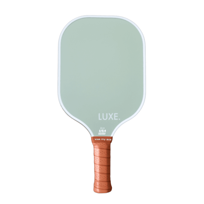 The LUXE Pickleball Aesthetic Solids - Ace is a USA Pickleball Approved paddle with a light green face, rounded corners, white edging, and "LUXE." at the handle top wrapped in textured tan leather-like material. Paddle shown on white background.
