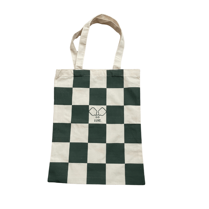The LUXE Pickleball Tote Bag features green and cream checks, two simple handles, and a pinky promise design above "LUXE." in black—ideal for carrying your pickleball gear.