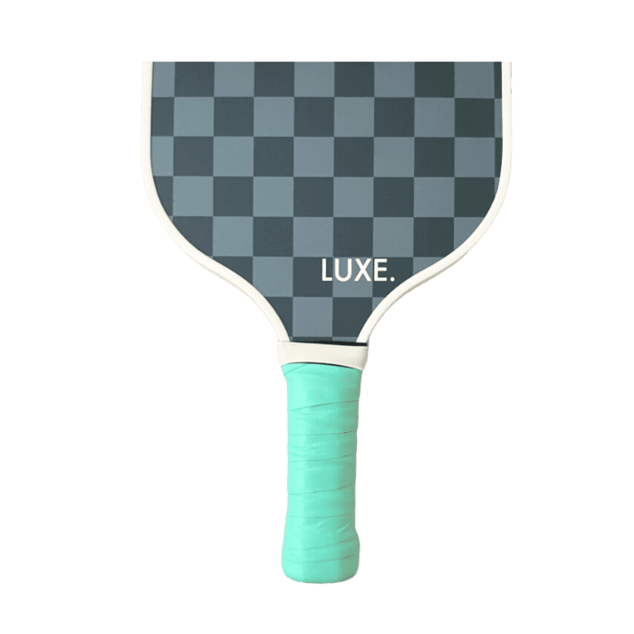 A LUXE Pickleball paddle with a gray checkerboard face, "LUXE." in white lettering, and a mint green overgrip handle is displayed against a plain white background.