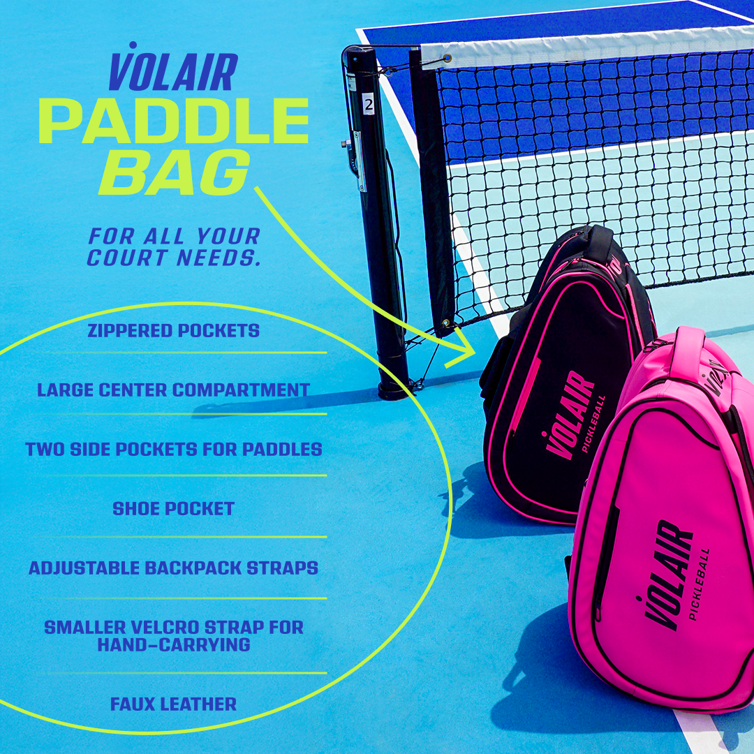 Two Volair Paddle Bags from Volair Pickleball—one black, one pink—sit on a blue court. Each features zippered pockets, large main compartment, paddle and shoe pockets, adjustable straps, hand-carry handle, and faux leather material.