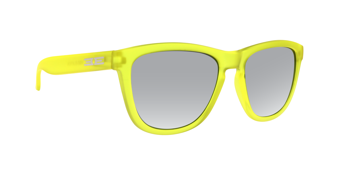 Epoch Eyewear’s VIBE sunglasses feature a matte, translucent neon yellow frame with gray tinted lenses and silver logo at the temples. Their bold, modern design adds an edgy touch to luxury eyewear. Shown on a white background.