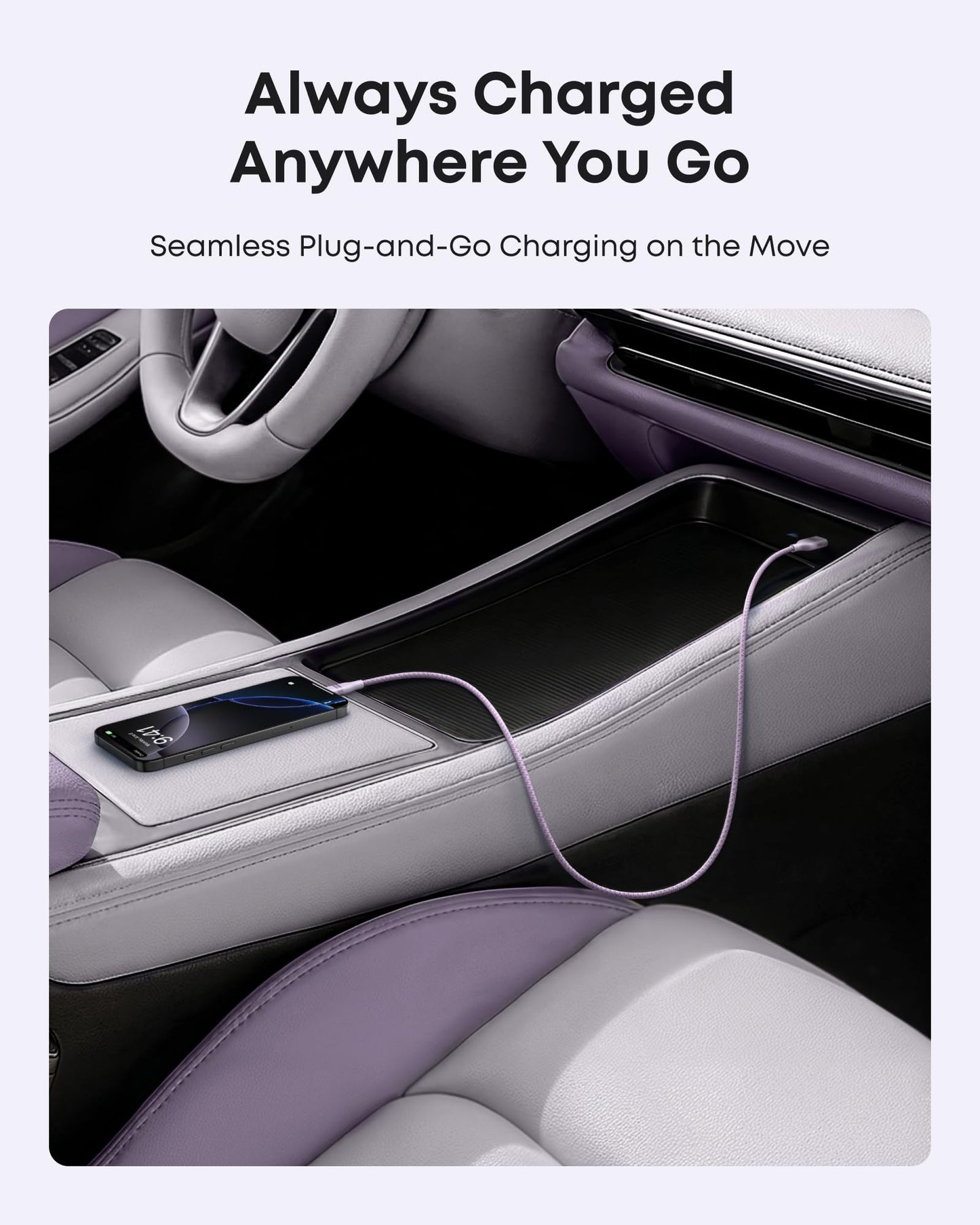 An Anker USB-A to USB-C Cable (3 ft/6 ft, Upcycled-Braided) keeps a smartphone charged on a modern car’s center console. The light purple and gray interior highlights effortless charging anywhere. Text above: Always Charged Anywhere You Go.