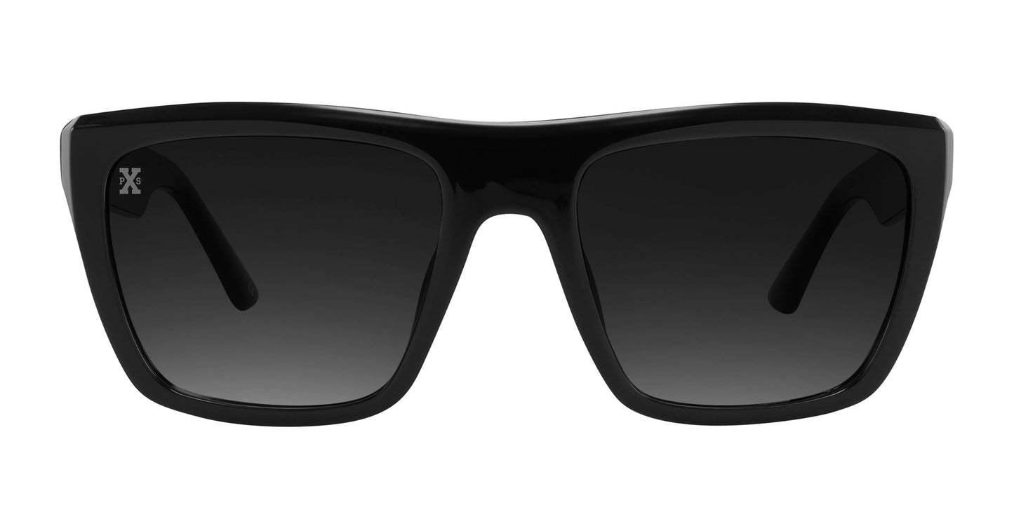 The Carbon by Neven Eyewear are black polarized sunglasses with thick, glossy frames, dark tinted lenses, slightly angled edges, and a small white logo on the upper left lens for a bold, modern look.