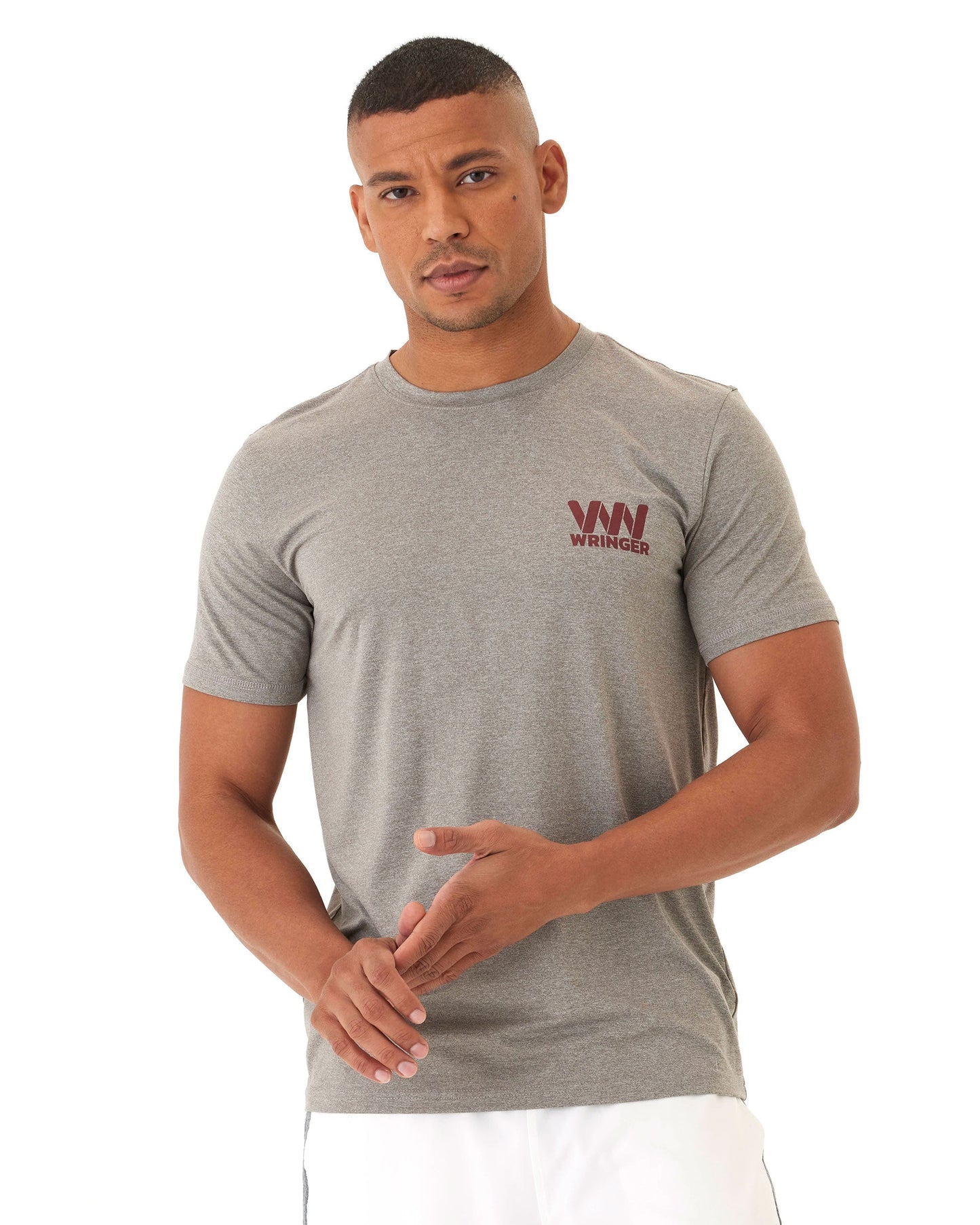 A man in a grey Wringer Wear Men's Short Sleeve Fast Hands Graphic Tee, designed with an athletic cut for a performance-ready look.