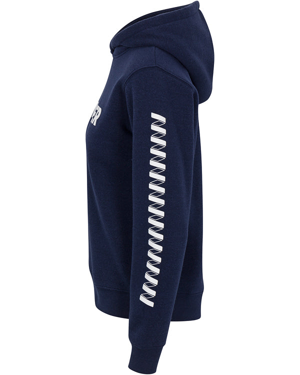 A side view of the Women's Core Wringer Graphic Hoodie by Wringer Wear in navy blue, featuring a white zigzag pattern down the sleeve, an athletic fit, a hood up, and part of a white chest logo or text visible.