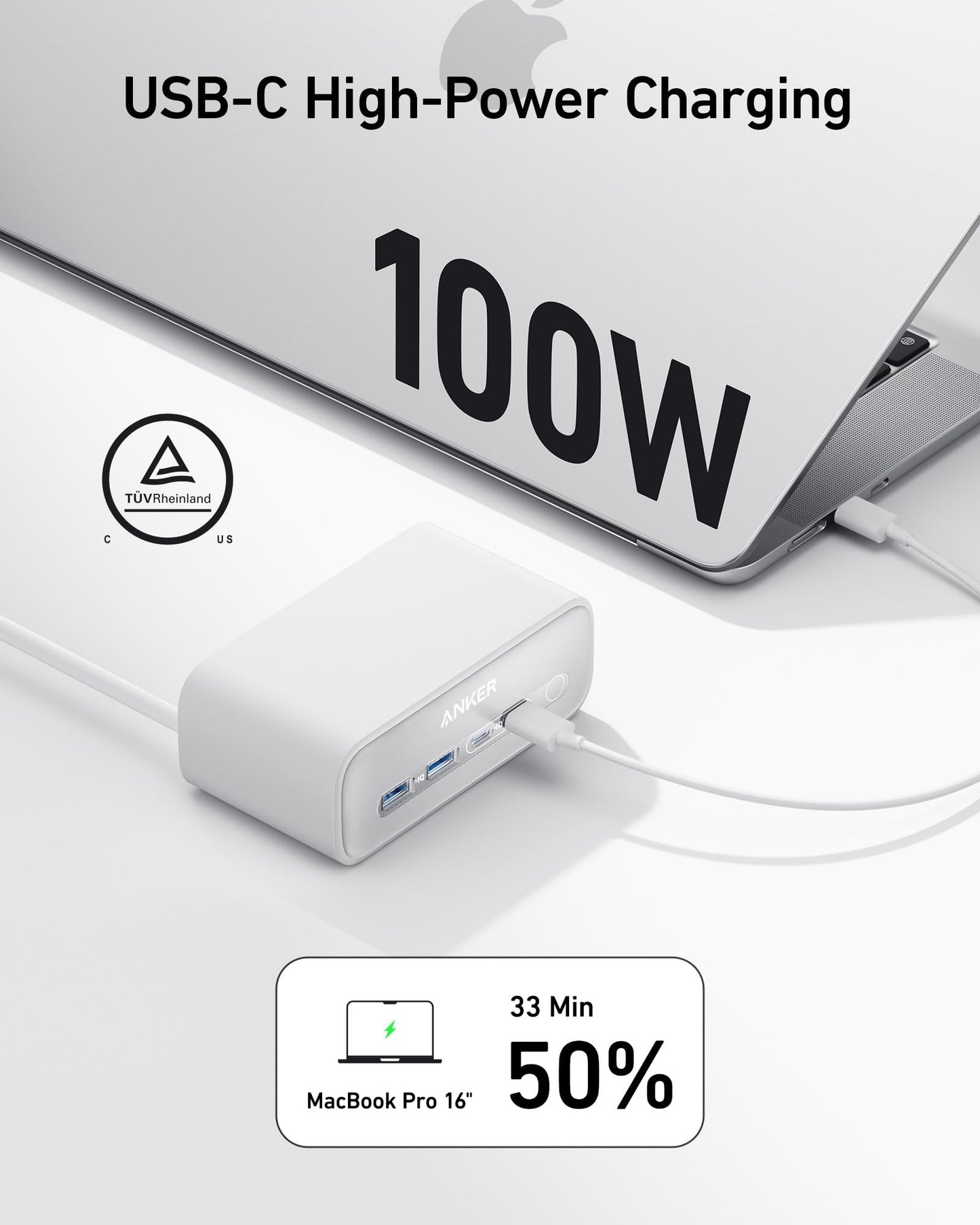 The white Anker Charging Station (7-in-1, 100W) is plugged into a silver laptop, showing 100W USB-C high-power charging. TÜV Rheinland certification graphics highlight a MacBook Pro 16 charging to 50% in just 33 minutes.