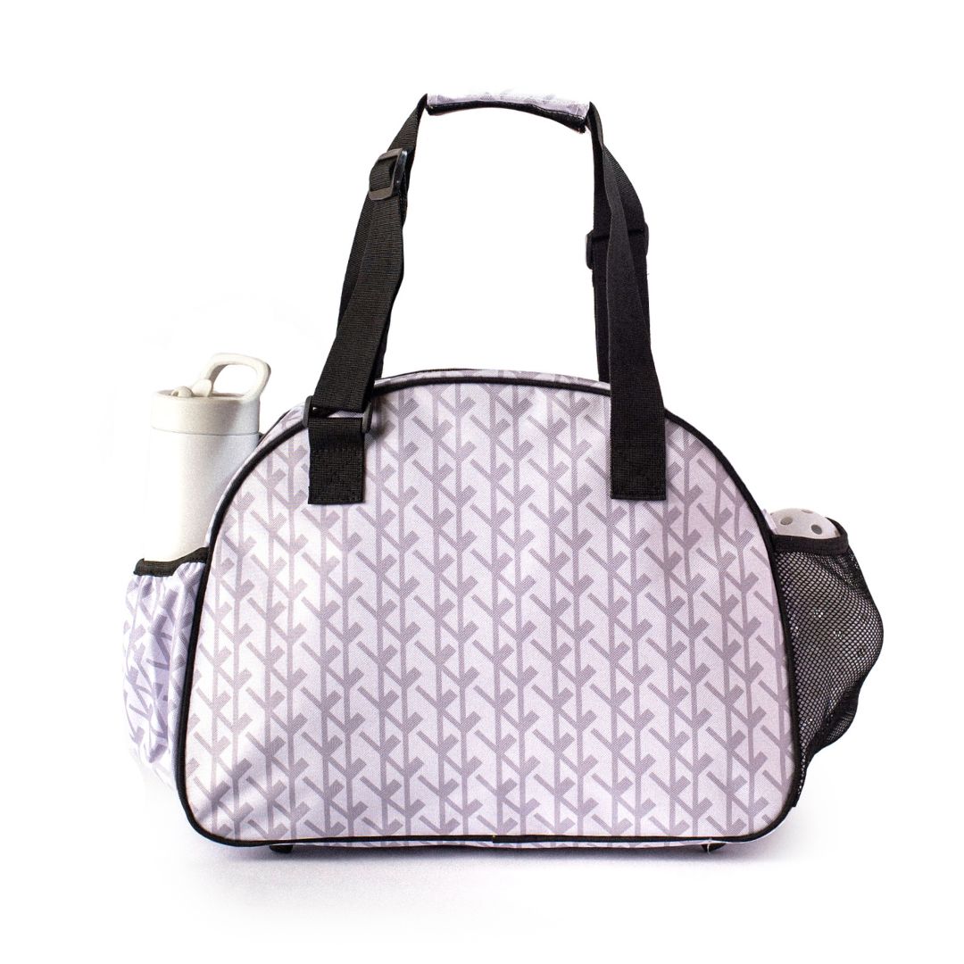 The Pik'le'Ball Sports Court Couture Premium Women's Pickleball Bag features a light gray arrow pattern, black handles and trim, multiple compartments, a paddle sleeve, side pockets for your bottle and gear—all against a white background.