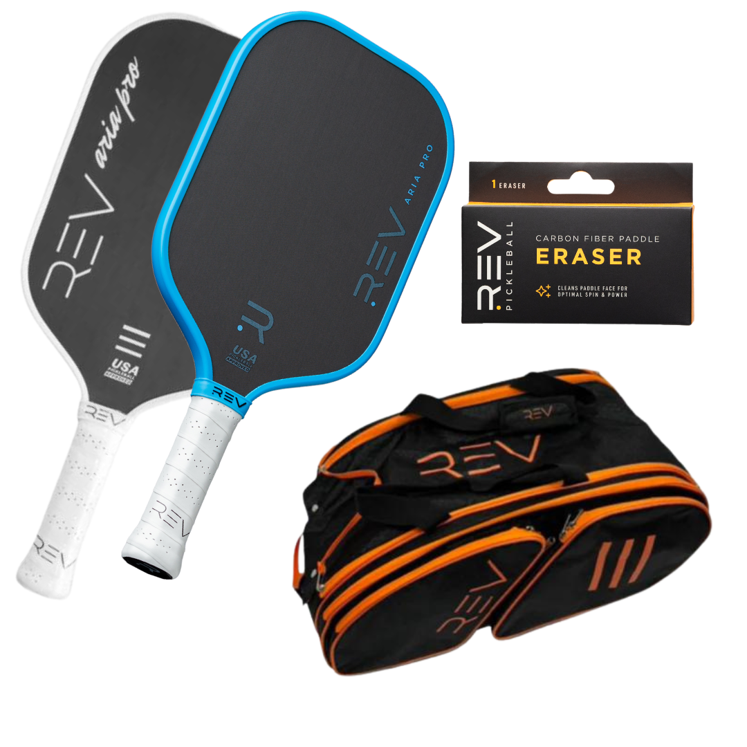The REV Pickleball Professional - Mix & Match - Bundle for 2 includes two paddles, a carbon fiber paddle eraser in a black and yellow box, and a black duffel bag with orange accents—all displayed on a white background.