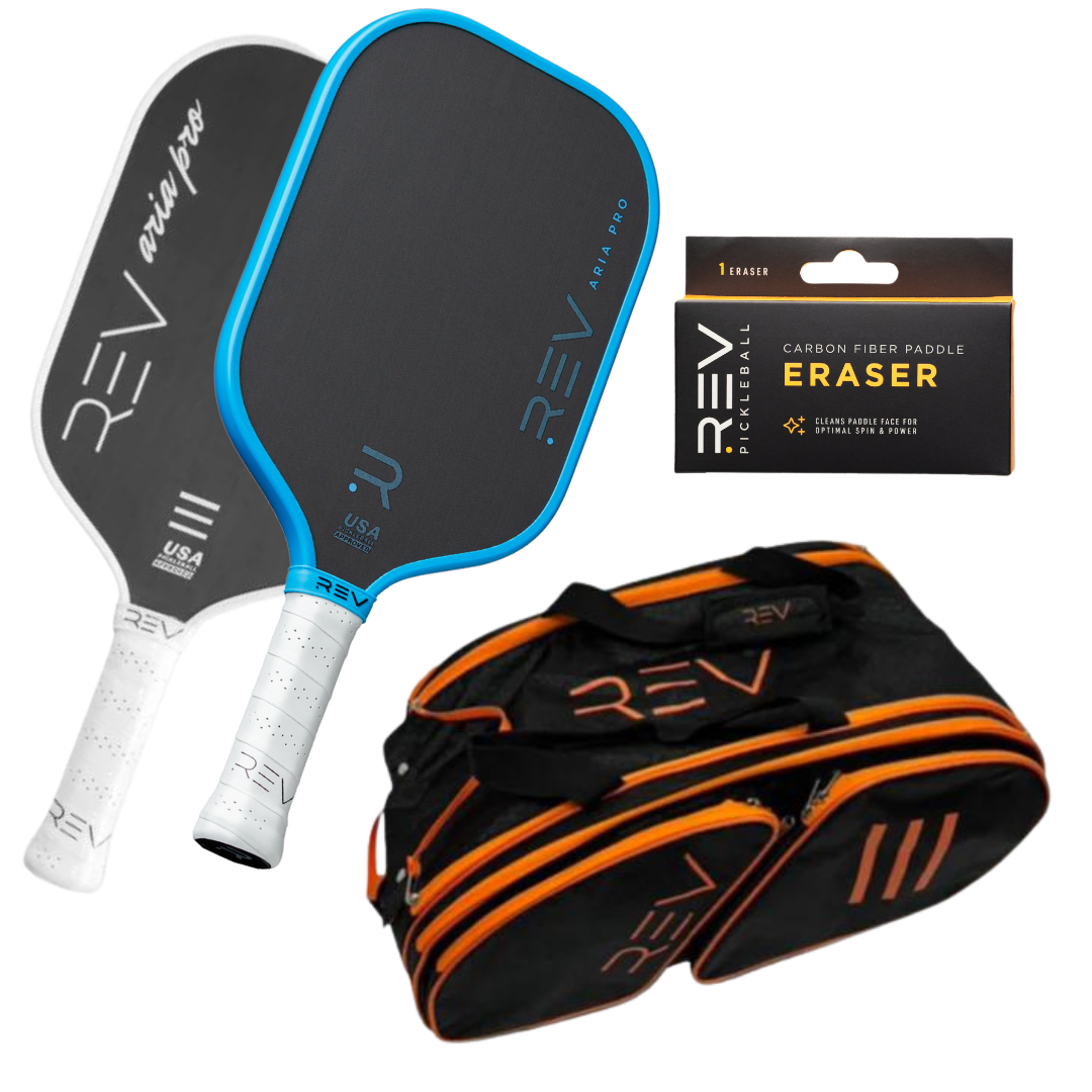 The REV Pickleball Professional - Mix & Match - Bundle for 2 includes two black paddles (white and blue edged), a black duffel bag with orange zippers and “REV” logo, and a small carbon fiber paddle eraser box.