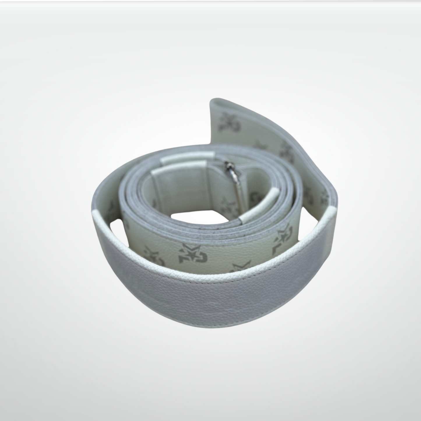 The iReliev I AM Leather Monogram Yoga Strap features coiled white leather and a subtle gray abstract logo pattern inside. Its discreet buckle shows against a softly shaded light gray background, embodying best-in-class style.