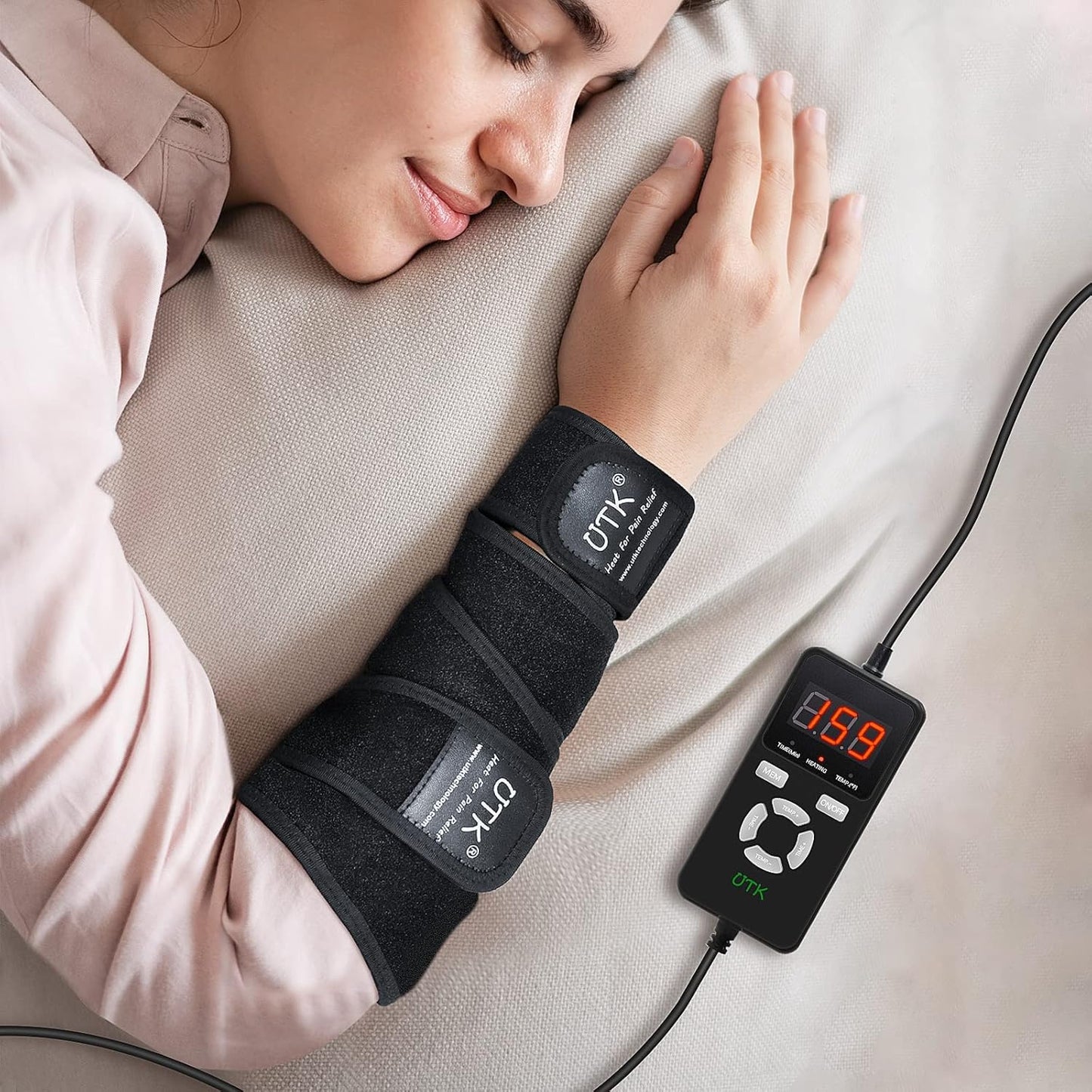 A woman rests on a light pillow, wearing the iReliev Far Infrared Heating Pad Wrap with Far Jade, strapped around her forearm. A digital controller beside her displays “139” in red numbers with several buttons visible.