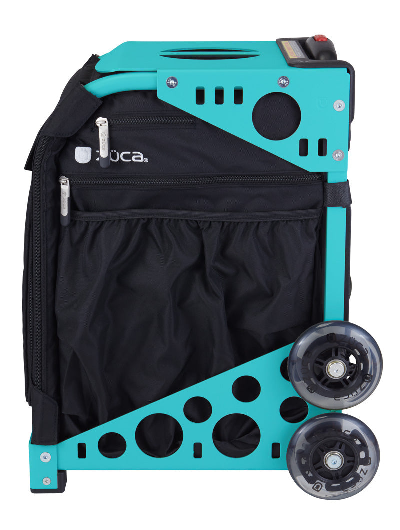 The Pickleball Sport Black/Black by ZUCA is a rolling pickleball bag with a black fabric body, metal frame, two large clear wheels, zippered pockets, and circular cutouts—ideal for stylish pickleball storage.