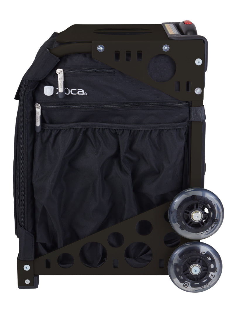 The ZUCA Pickleball Sport Black/Black is a collapsible rolling bag with a sturdy metal frame, mesh pouch, zippered pockets, and two large transparent wheels; the brand “ZUCA” appears near the zippers.