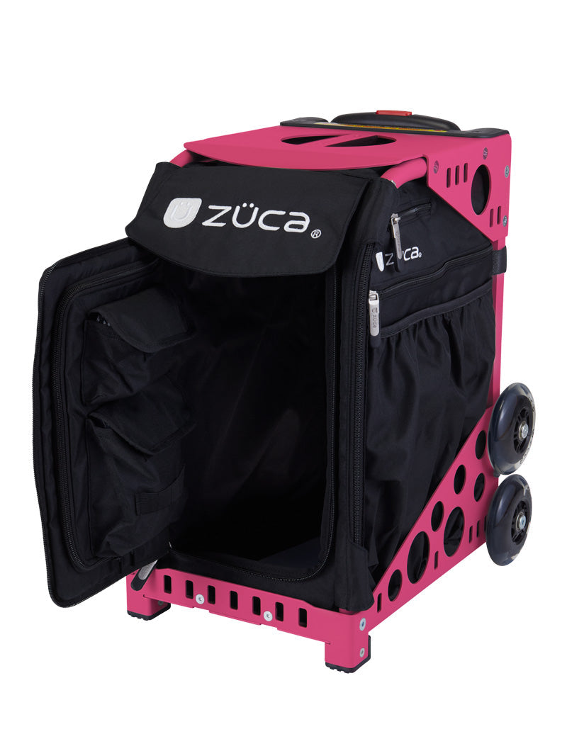 The ZUCA Pickleball Sport Black/Black rolling bag is shown with its front zippered door open, revealing internal storage pockets. It features a sturdy metal frame, side pockets, two large rear wheels, and two smaller front feet for stability.