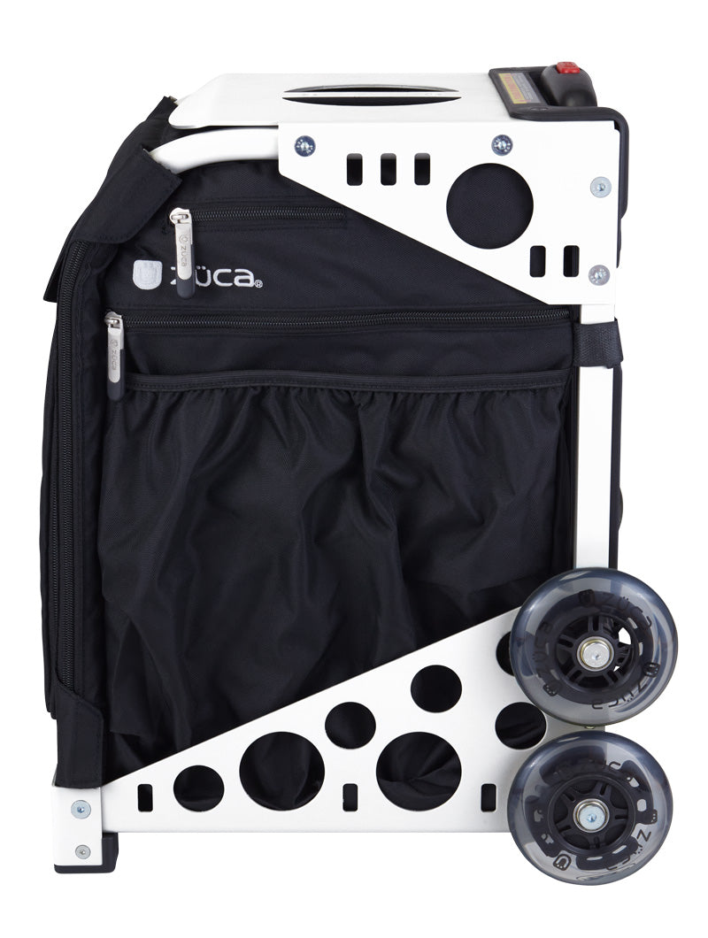 The ZUCA Pickleball Sport Black/Black bag is a compact, foldable rolling bag in black and white with two large clear wheels, metal frame, side zip pockets, mesh storage, and circular cutouts for a modern, lightweight look. Brand logo visible.