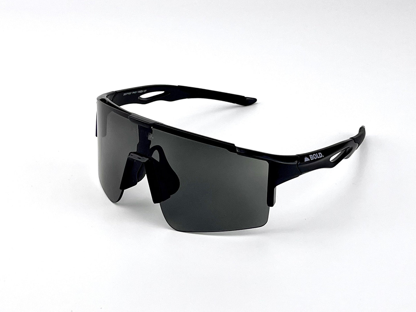 BOLD Wavelength Performance Sunglasses by boldouterwear: black trail-ready eyewear with dark rectangular lenses, a wraparound frame, nose pad, and angular arms featuring 'BOLD.' in white. Ideal for MTB, ski & lifestyle. Plain white background.
