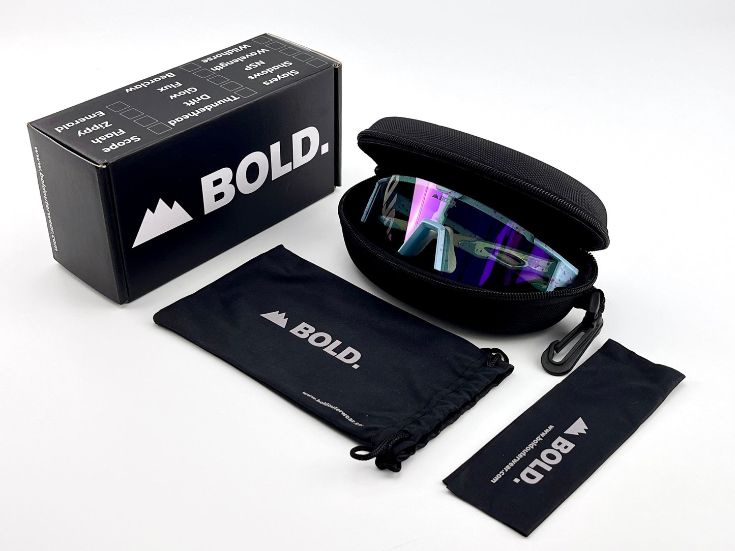 The BOLD Wavelength Performance Sunglasses by boldouterwear are shown in an open black hard case with a branded box, soft pouch, and cleaning cloth on a white background—ideal eyewear for MTB, ski, or trail running enthusiasts.