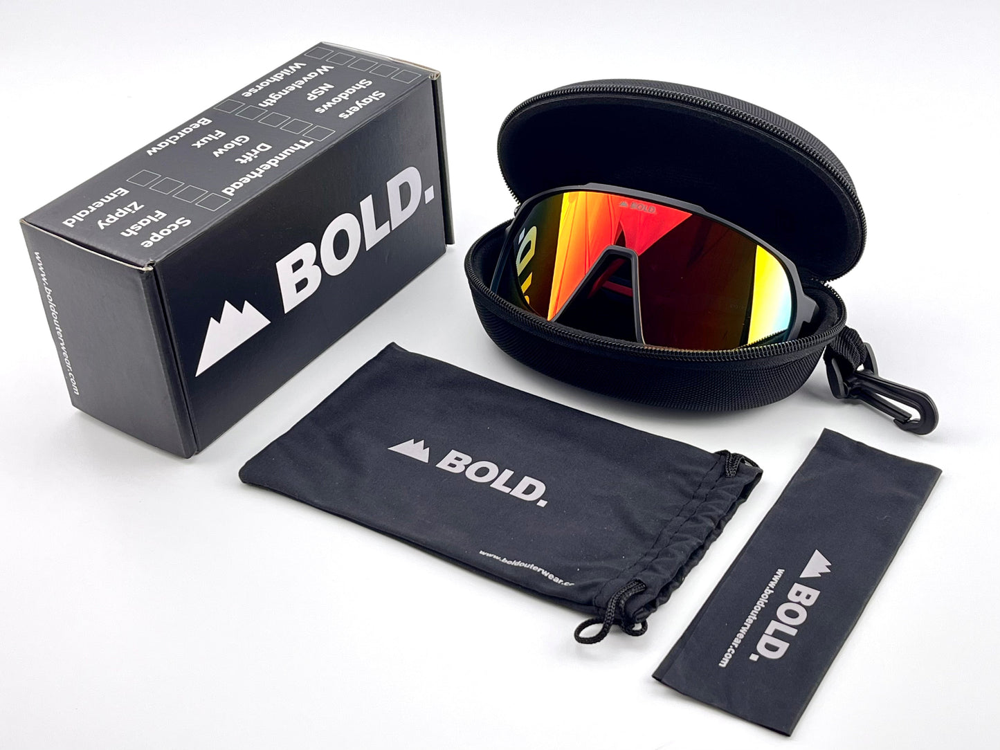 The BOLD Slayers Performance Sunglasses by boldouterwear feature orange reflective, oversized lenses and come with a hard zippered case, a soft pouch, and cleaning cloth—all branded "BOLD"—plus a black box displayed on a white background.