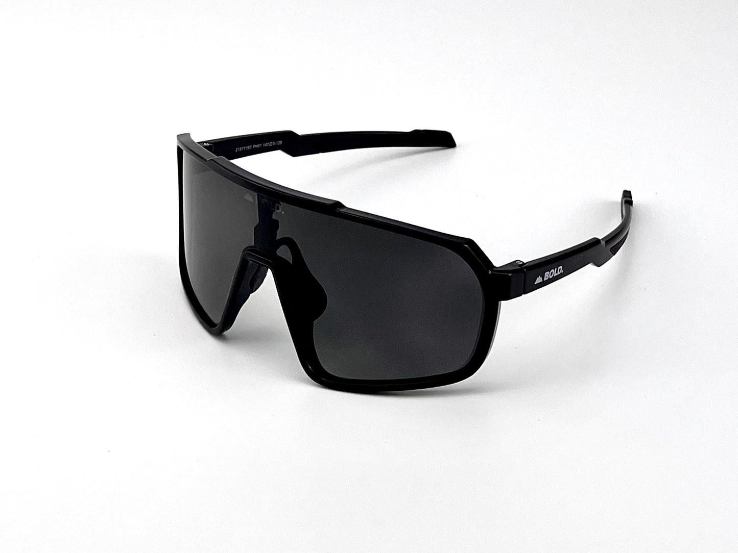 The BOLD Slayers Photochromic Sunglasses by boldouterwear feature large, dark wraparound lenses, thick frames, and straight temples with a white “BOLLÉ” logo—perfect for MTB, ski, and lifestyle wear with sporty style and bold coverage.