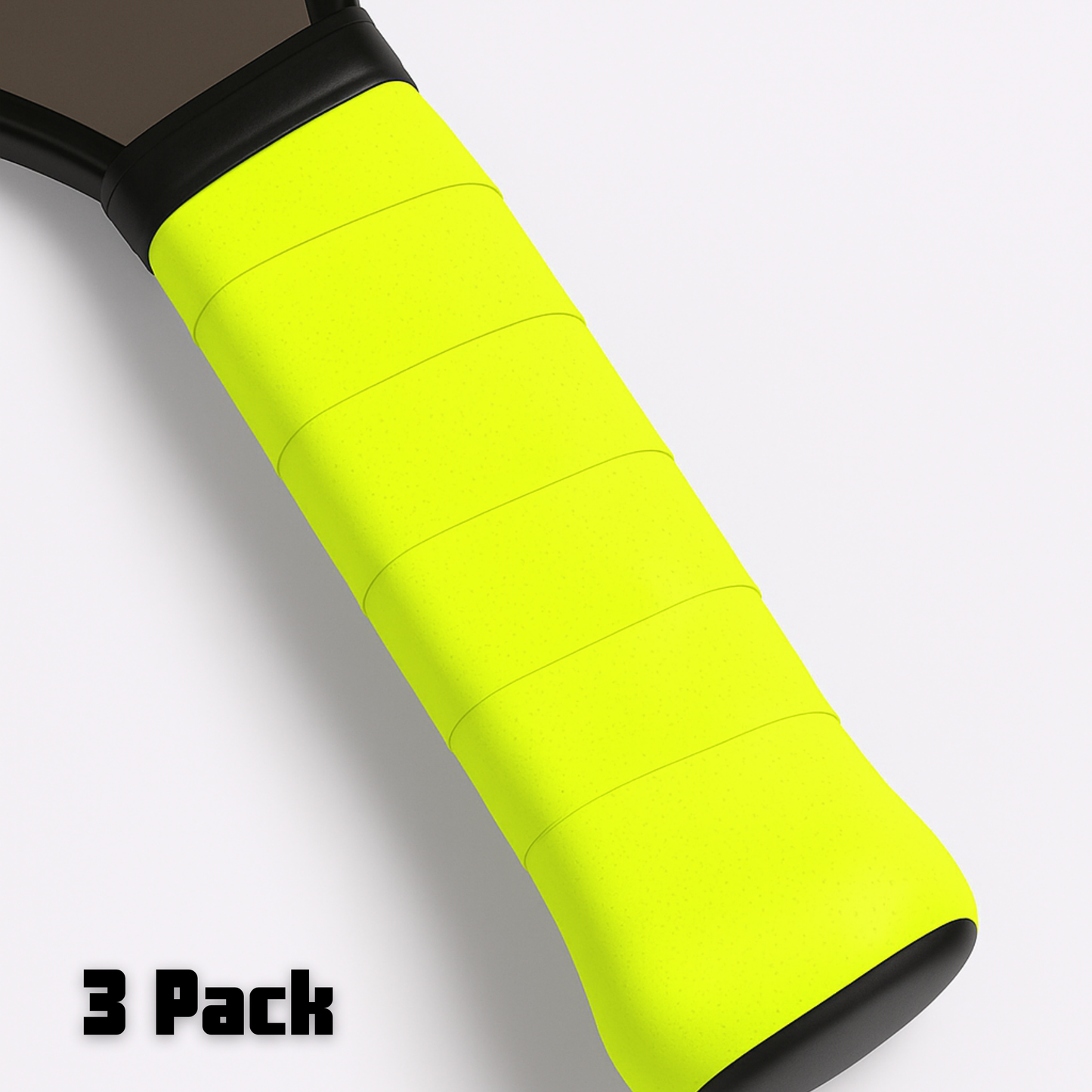 Close-up of an Edgy Pickleball Hybrid Overgrip wrapped on a racket handle, showing its smooth and textured neon yellow surface for extra tackiness. The white background features bold black text “3 Pack.” Only part of the racket appears in view.