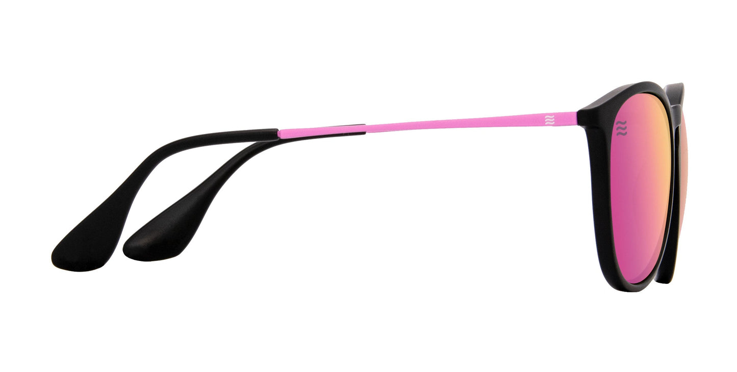 Side view of Neven Eyewear's Quinn sunglasses: stylish polarized shades with a black TR90 frame, pink temples, mirrored pink-orange lenses, and slim pink metal arms with black curved ends for comfort and modern contrast.