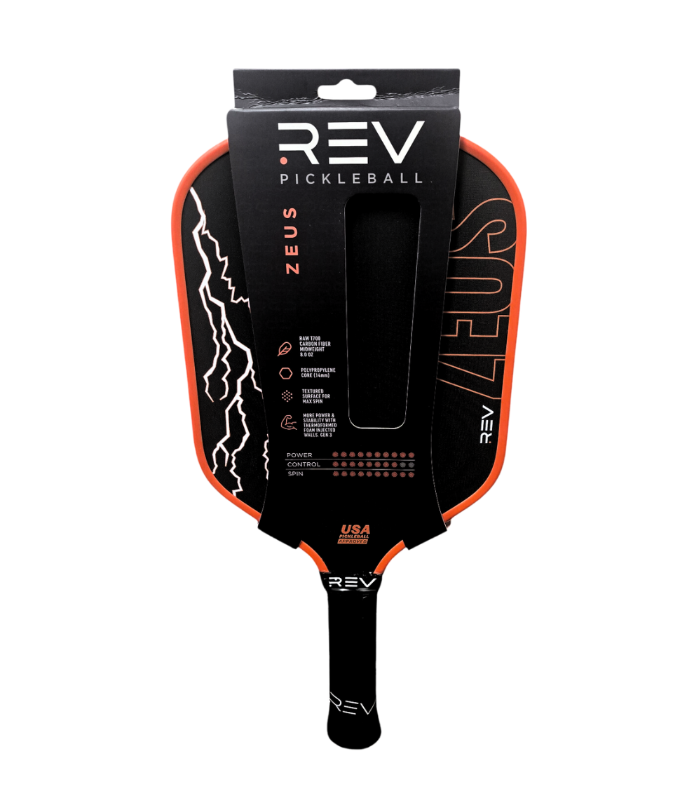 The ZEUS Pickleball Paddle by REV Pickleball is shown in modern black and orange packaging, featuring T700 Raw Carbon Fiber, white lightning graphics, bold ZEUS lettering, and a black handle with the REV logo in white.