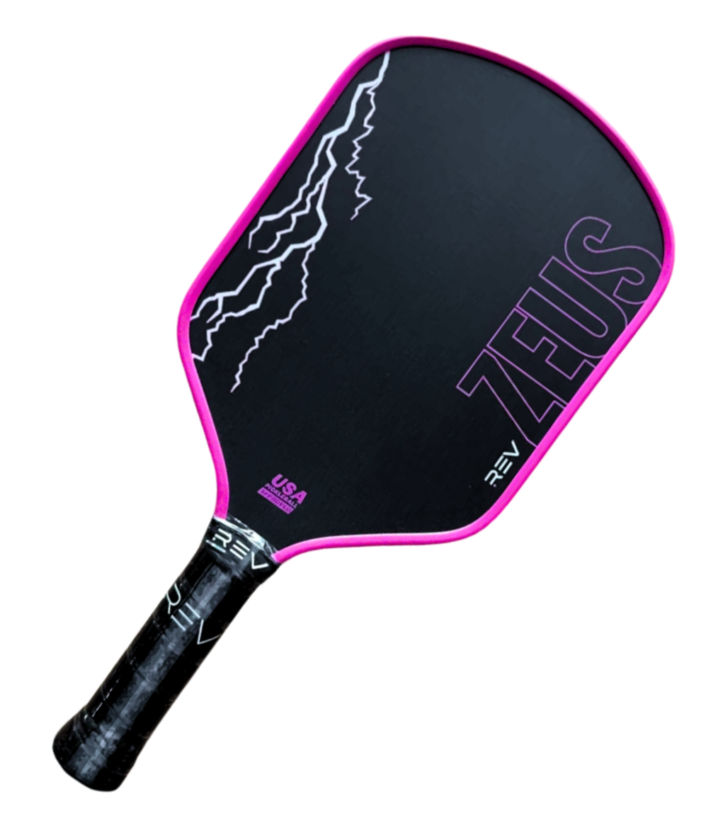 The ZEUS Pickleball Paddle by REV Pickleball features a black T700 Raw Carbon Fiber face, pink edge guard, white lightning graphic, purple ZEUS lettering, textured grip, and the USA Pickleball logo on the face.