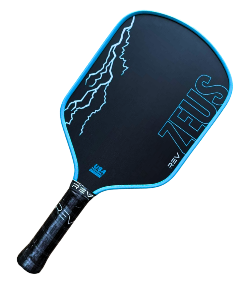 The ZEUS Pickleball Paddle by REV Pickleball features a black T700 Raw Carbon Fiber face, blue edges, lightning bolt graphics, bold blue “ZEUS” lettering, a black grip with “REV” branding, and the USA Pickleball logo at the base.