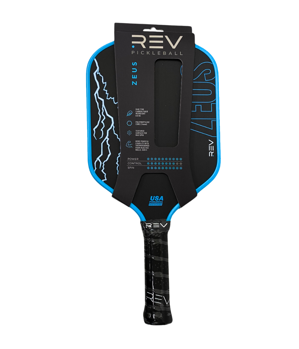The ZEUS Pickleball Paddle by REV Pickleball features a black design with blue accents, white lightning graphics on the left edge, "ZEUS" in blue letters, a black grip handle, and is crafted from T700 Raw Carbon Fiber. Packaging appears on the upper portion.