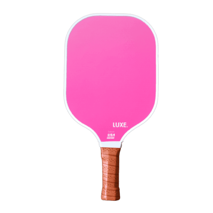 The Aesthetic Solids - Leisure paddle by LUXE Pickleball is pink with a white handle, features a honeycomb core, and is USA Pickleball Approved.