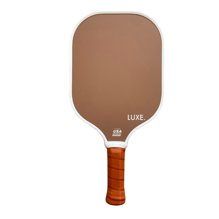 The Aesthetic Solids - Leisure pickleball paddle by LUXE Pickleball features a brown fiberglass face, honeycomb core, rectangular shape with rounded edges, white border, and light brown grip. "LUXE." and "USA" are printed in white on the face.