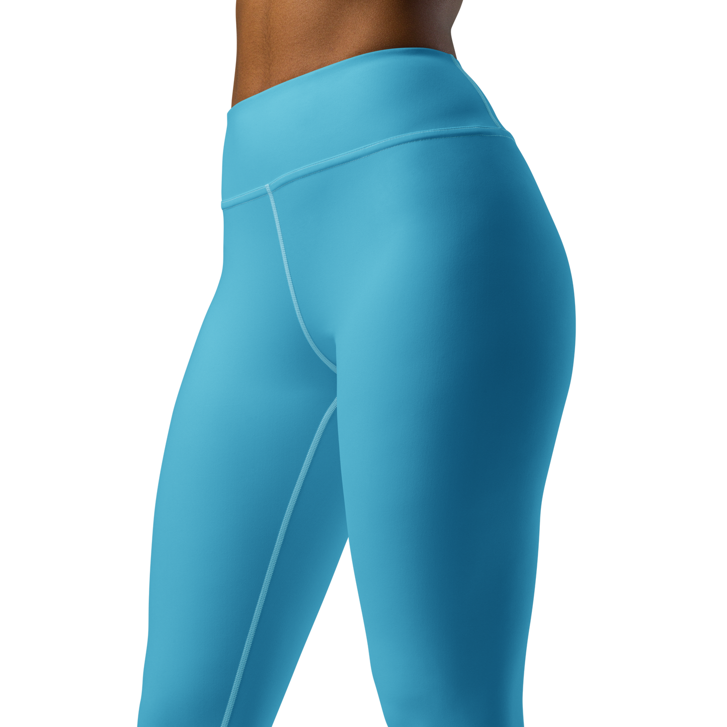 A person wears CROWN PICKLEBALL - High-performance Leggings (Sky) by Crown Pickleball. The bright blue, high-waisted, form-fitting leggings with visible seams highlight an athletic style against a plain white background.