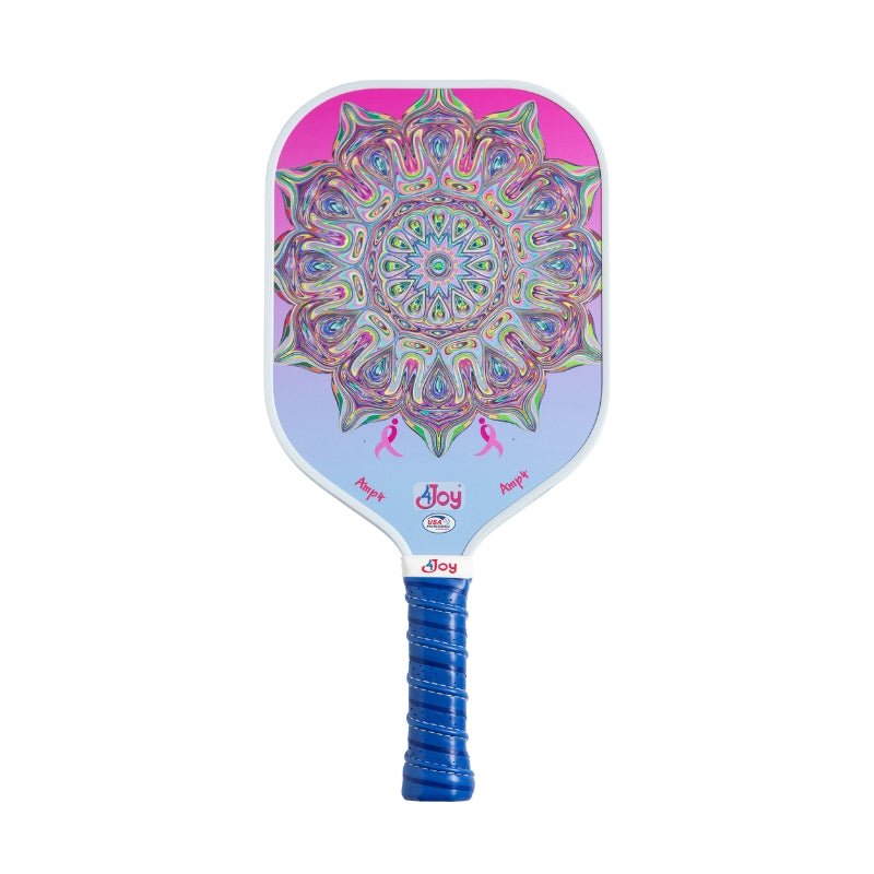 The AMP4 Pickleball Paddle - Special Edition DinkforPink by 4Joy Paddles features a pink-to-blue T700 carbon fiber face, vibrant mandala in pink, green, and purple, blue grip handle, and "Joy" printed below the design for a cheerful touch.