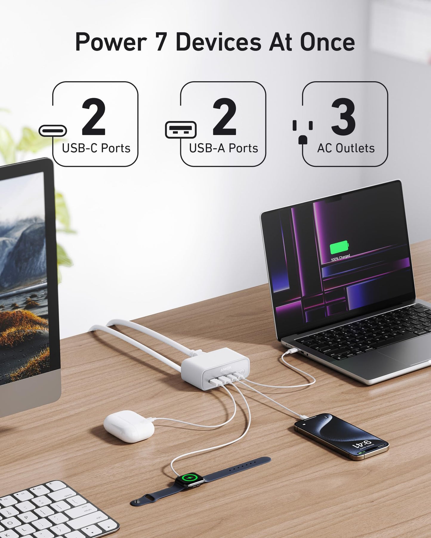 The Anker 7-in-1 USB-C Charging Station (100W) BOA powers a laptop, earbuds, smartphone, and smartwatch on a desk. It offers 2 USB-C ports, 2 USB-A ports, and 3 AC outlets for organized charging in one compact unit.